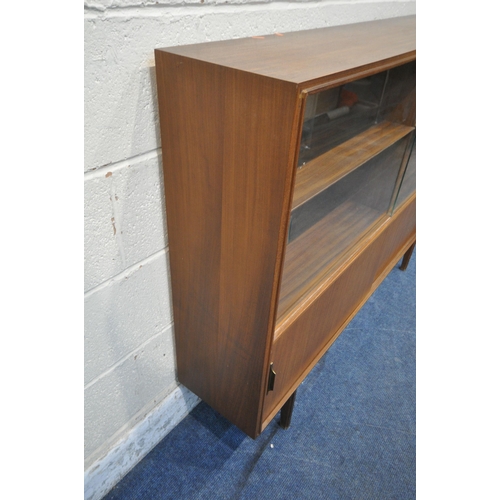 1281 - A MID CENTURY TEAK BOOKCASE, with double glazed sliding doors, above double sliding doors, width 138... 