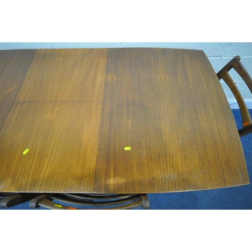 1282 - WHITE AND NEWTON, A MID CENTURY TEAK EXTENDING DINING TABLE, with a single fold out leaf, raised on ... 