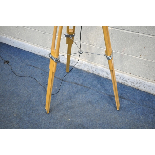 1295 - A BEECH STANDARD LAMP, raised on height adjustable legs, height 130cm (condition report: generals si... 