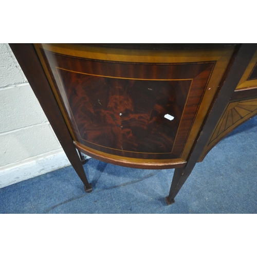 1303 - A REPRODUCTION MAHOGANY BOW FRONT SIDEBOARD, fitted with two cupboard doors, three drawers, raised o... 