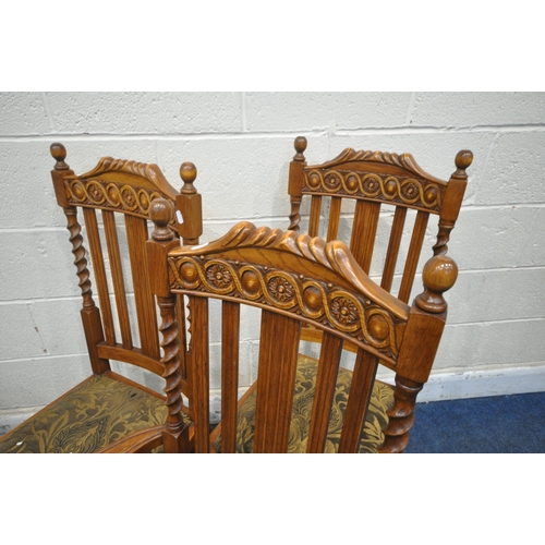 1306 - A SET OF SIX EARLY 20TH CENTURY OAK CHAIRS, including two carvers, with twin finials, carved details... 