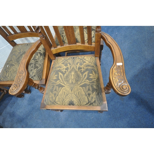 1306 - A SET OF SIX EARLY 20TH CENTURY OAK CHAIRS, including two carvers, with twin finials, carved details... 