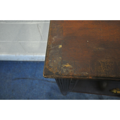 1307 - A REPRODUX MAHOGANY SIDEBOARD, fitted with two doors, flanking a single drawer, raised on square tap... 