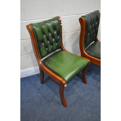 1314 - A SET OF FOUR 20TH CENTURY MAHOGANY CHAIRS, with green leather buttoned upholstery, on front sabre l... 