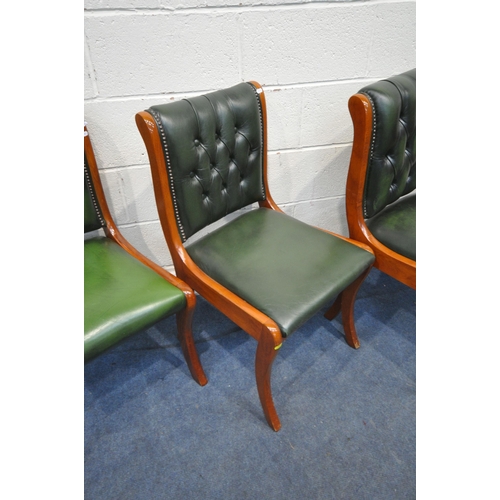 1314 - A SET OF FOUR 20TH CENTURY MAHOGANY CHAIRS, with green leather buttoned upholstery, on front sabre l... 