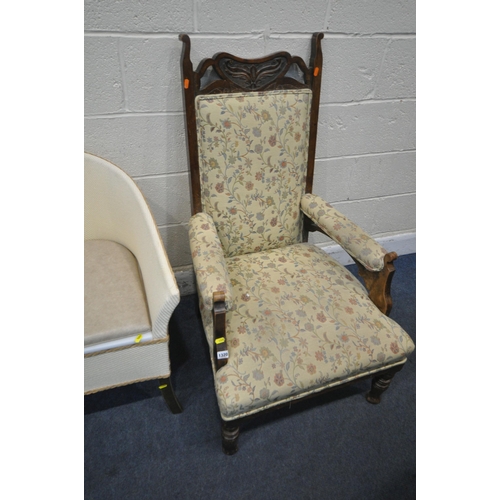 1320 - AN EARLY 20TH CENTURY MAHOGANY ARMCHAIR, with shaped crest, floral upholstery, open armrests, raised... 