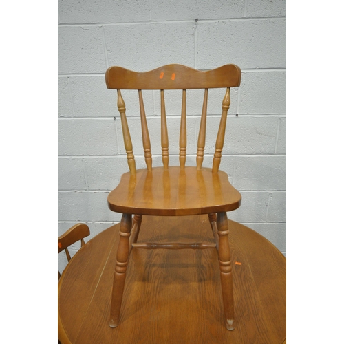 1325 - A LATE 20TH CENTURY DROP LEAF, raised on turned legs, diameter 102cm x closed width 68cm x height 75... 