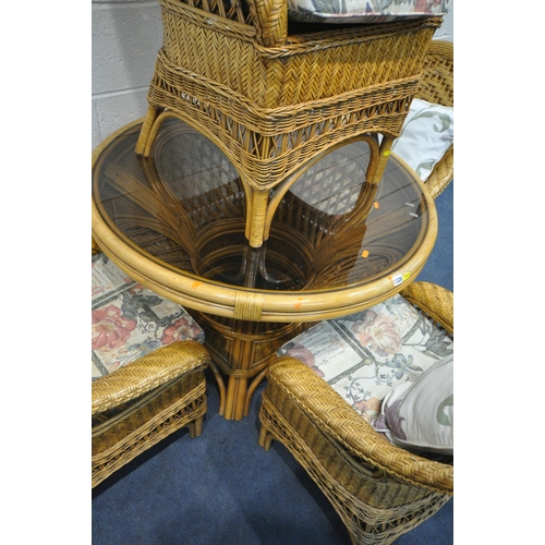 1326 - A RATTAN FIVE PIECE RATTAN CONSERVATORY SUITE, comprising a circular table, with a smoked glass inse... 