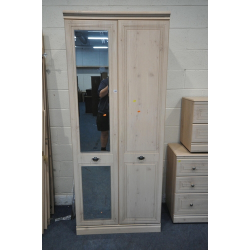 1329 - A MODERN SIX PIECE BEDROOM SUITE, comprising a double door wardrobe, with a single mirror door, widt... 