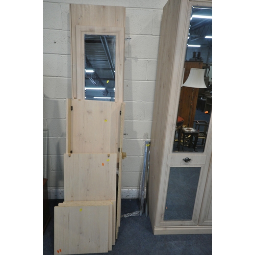 1329 - A MODERN SIX PIECE BEDROOM SUITE, comprising a double door wardrobe, with a single mirror door, widt... 