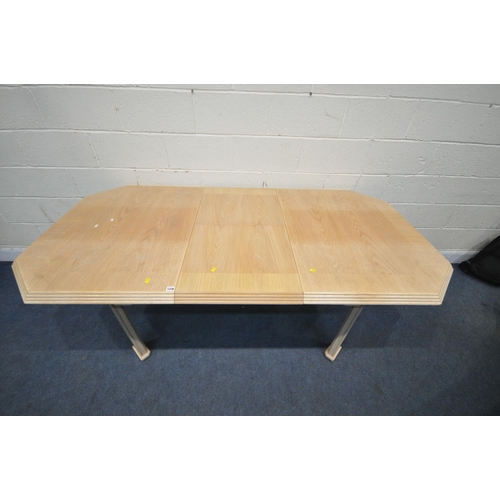 1336 - A BLONDE OAK EXTENDING DINING TABLE, with a single fold out leaf, open length 202cm x closed length ... 