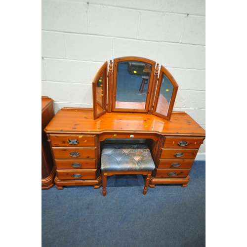 1347 - A DUCAL PINE SIX PIECE BEDROOM SUITE, comprising a dressing table, fitted with nine drawers, width 1... 