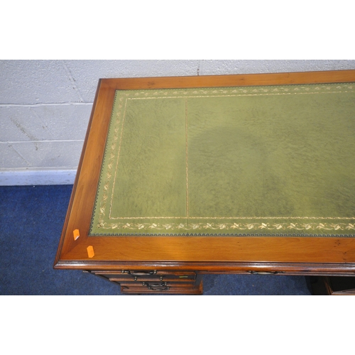 1351 - A 20TH CENTURY YEW WOOD TWIN PEDESTAL DESK, with a green leather writing surface, fitted with eight ... 