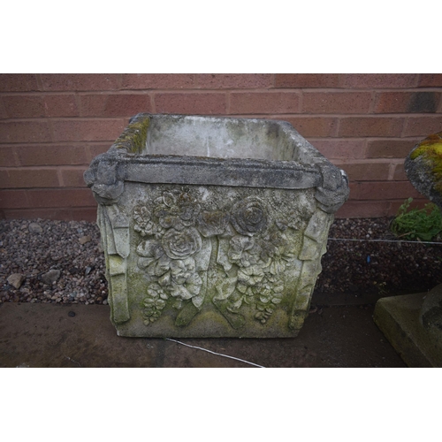 1004 - A SQUARE WEATHERED COMPOSITE PLANTER, with details including knots and ribbons, and fruiting flowers... 