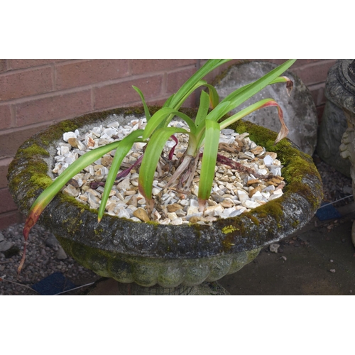 1005 - A PAIR OF LOW WEATHERED COMPOSITE CAMPAGNA GARDEN URNS, on a square base, diameter 57cm x height 46c... 