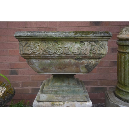 1006 - A SQUARE WEATHERED COMPOSITE GARDEN PLANTER, with a floral border, on a later separate plinth, 53cm ... 