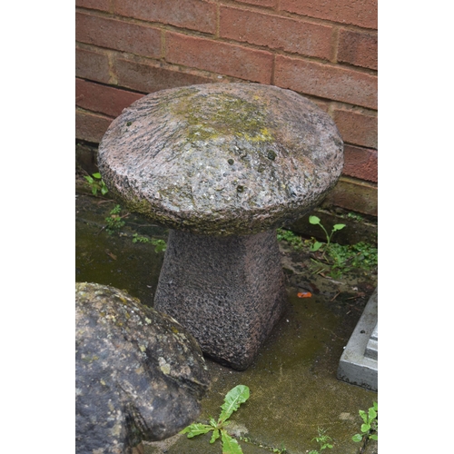 1013 - A SMALL MODERN COMPOSITE STADDLE STONE, diameter 38cm x height 46cm, along with weathered mushroom s... 