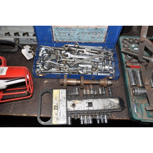 1057 - A COLLECTION OF AUTOMOTIVE TOOLS including bearing pullers and installers, partial socket sets, span... 