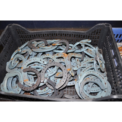 1076 - TWO TRAYS CONTAINING A QUANTITY OF HORSESHOES mostly painted