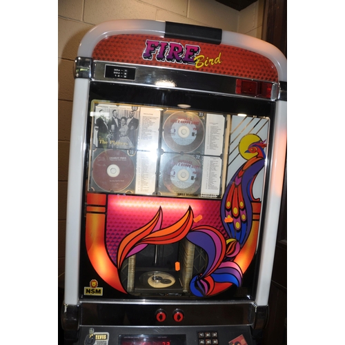 1109 - A NSM FIRE BIRD COMPACT DISC JUKEBOX ON STAND in need of attention width 59cm depth 46cm height 185c... 