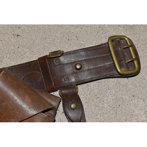 162 - A VINTAGE BROWN LEATHER PISTOL HOLSTER AND A BROWN LEATHER BELT (2)