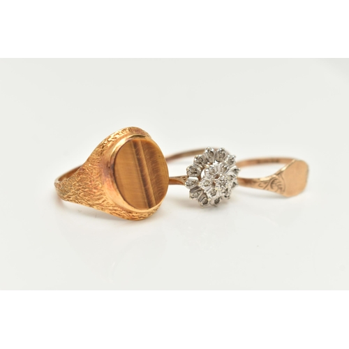 14 - THREE 9CT GOLD RINGS, to include a textured signet ring set with an oval tiger's eye panel, a furthe... 