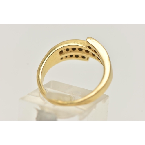 21 - AN 18CT GOLD DIAMOND RING, a three row channel set diamond ring, set with graduated round brilliant ... 