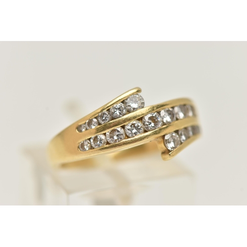 21 - AN 18CT GOLD DIAMOND RING, a three row channel set diamond ring, set with graduated round brilliant ... 