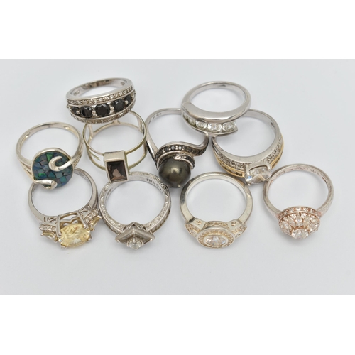 32 - TEN WHITE METAL RINGS, to include a rectangular smoky quartz ring, an imitation pearl ring, various ... 