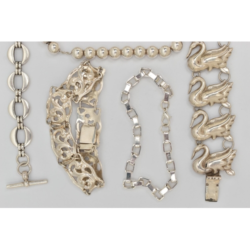 37 - SIX ITEMS OF WHITE METAL JEWELLERY, to include a swan bracelet, a scrolling acanthus panel bracelet,... 