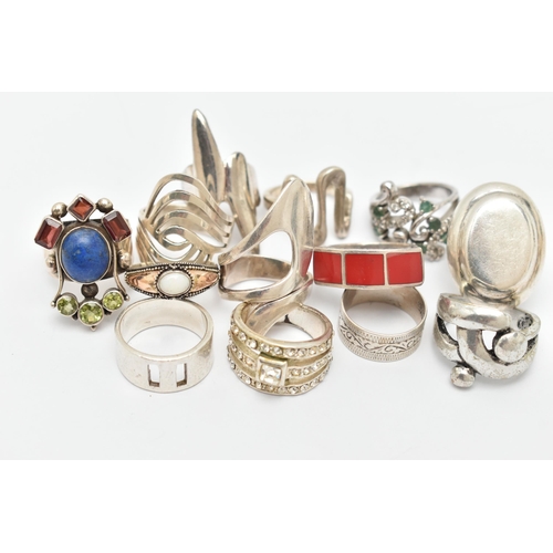 39 - AN ASSORTMENT OF THIRTEEN WHITE METAL RINGS, to include a selection of abstract designs and gem set ... 