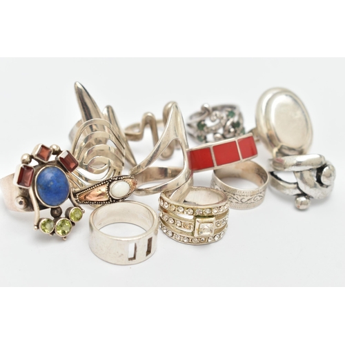 39 - AN ASSORTMENT OF THIRTEEN WHITE METAL RINGS, to include a selection of abstract designs and gem set ... 