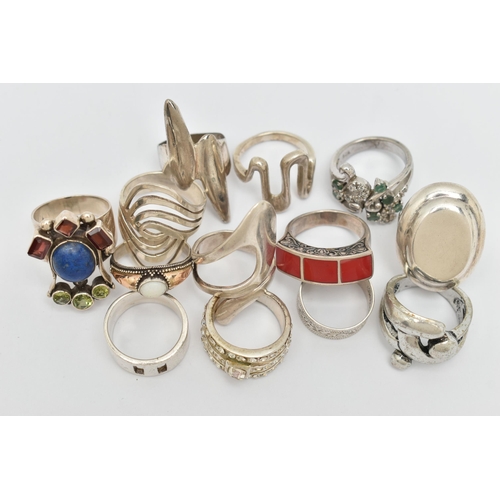 39 - AN ASSORTMENT OF THIRTEEN WHITE METAL RINGS, to include a selection of abstract designs and gem set ... 