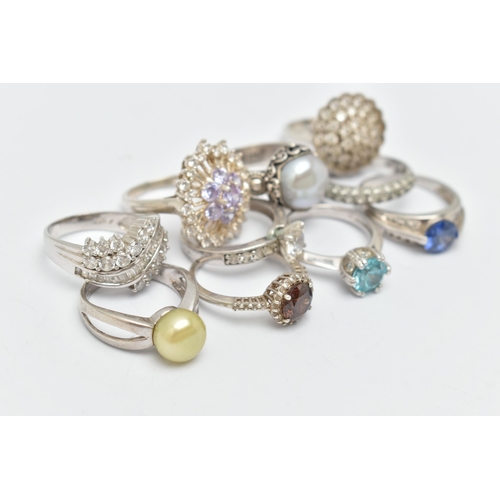 48 - TEN WHITE METAL RINGS, to include various designs set with cubic zironia, including cluster rings, c... 