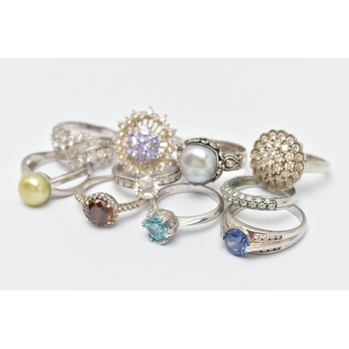 48 - TEN WHITE METAL RINGS, to include various designs set with cubic zironia, including cluster rings, c... 