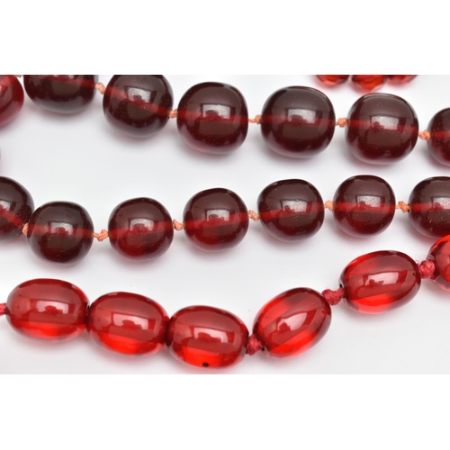 67 - AN ASSORTMENT OF CHERRY AMBER BAKELITE AND PLASTIC JEWELLERY, to include a pair of cherry amber Bake... 