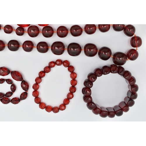 67 - AN ASSORTMENT OF CHERRY AMBER BAKELITE AND PLASTIC JEWELLERY, to include a pair of cherry amber Bake... 