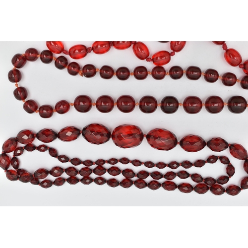 67 - AN ASSORTMENT OF CHERRY AMBER BAKELITE AND PLASTIC JEWELLERY, to include a pair of cherry amber Bake... 