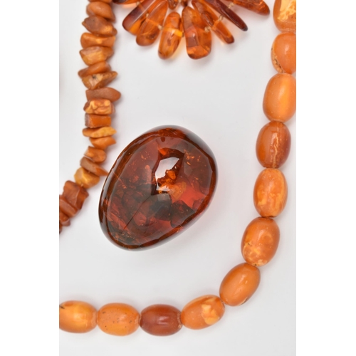 68 - AN ASSORTMENT OF AMBER AND COMPOSITE AMBER, to include a natural amber graduated beaded necklace, co... 