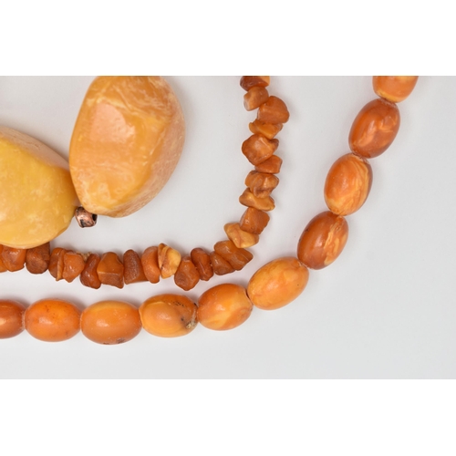 68 - AN ASSORTMENT OF AMBER AND COMPOSITE AMBER, to include a natural amber graduated beaded necklace, co... 