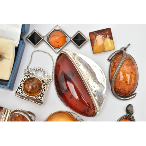 69 - AN ASSORTMENT OF COPAL AMBER JEWELLERY, to include an amber ring set win a yellow metal mount, stamp... 