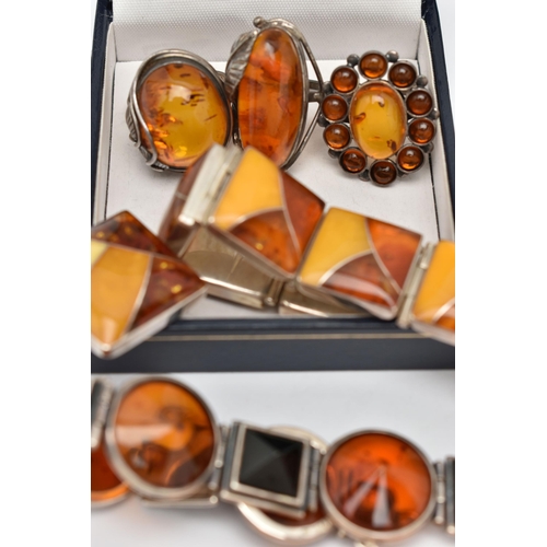 69 - AN ASSORTMENT OF COPAL AMBER JEWELLERY, to include an amber ring set win a yellow metal mount, stamp... 