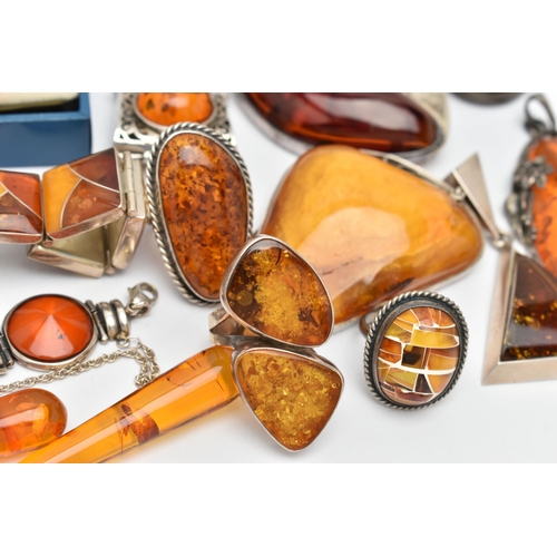 69 - AN ASSORTMENT OF COPAL AMBER JEWELLERY, to include an amber ring set win a yellow metal mount, stamp... 