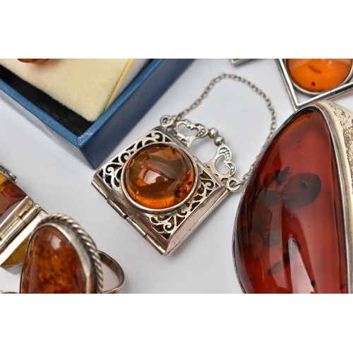 69 - AN ASSORTMENT OF COPAL AMBER JEWELLERY, to include an amber ring set win a yellow metal mount, stamp... 