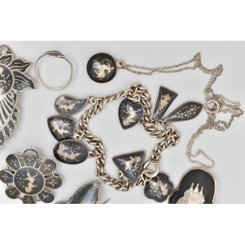 73 - A SELECTION OF WHITE METAL DAMASCENE JEWELLERY, to include six brooches, marks to include 'Siam Silv... 