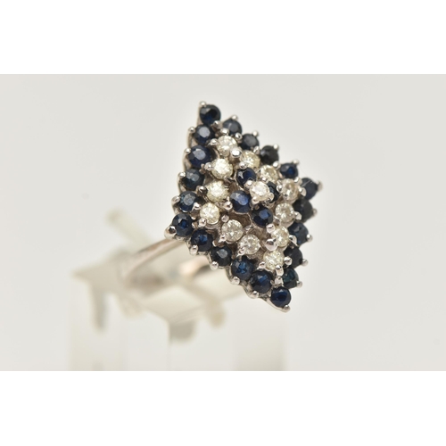 8 - AN 18CT WHITE GOLD DIAMOND AND SPINEL CLUSTER RING, designed as a marquise shape, four tier cluster ... 