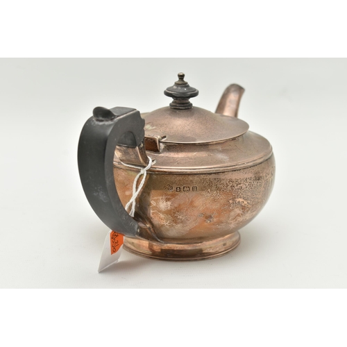 104 - AN 'ELKINGTON & CO' SILVER TEAPOT, polished form with engraved monogram, fitted with an ebonised han... 