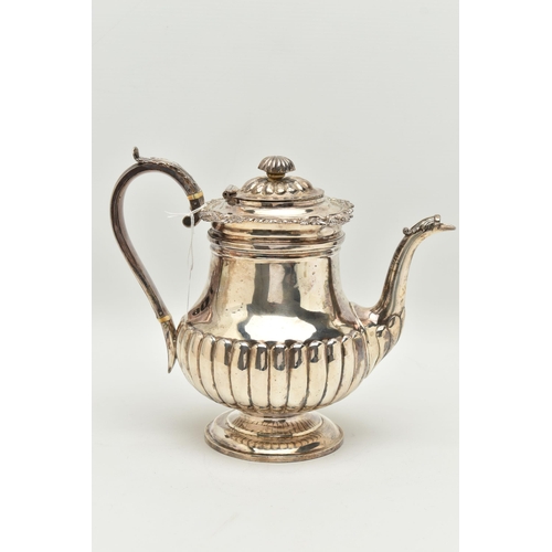 106 - A GEORGE IV SILVER PEDESTAL COFFEE POT, the knopped finial with ivory insulator, reeded hinged lid a... 