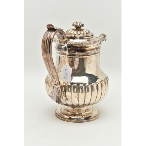 106 - A GEORGE IV SILVER PEDESTAL COFFEE POT, the knopped finial with ivory insulator, reeded hinged lid a... 