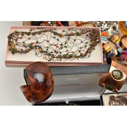 131 - A LARGE BOX OF ASSORTED COSTUME JEWELLERY, to include a rolled gold buckle bangle, a coral gold plat... 